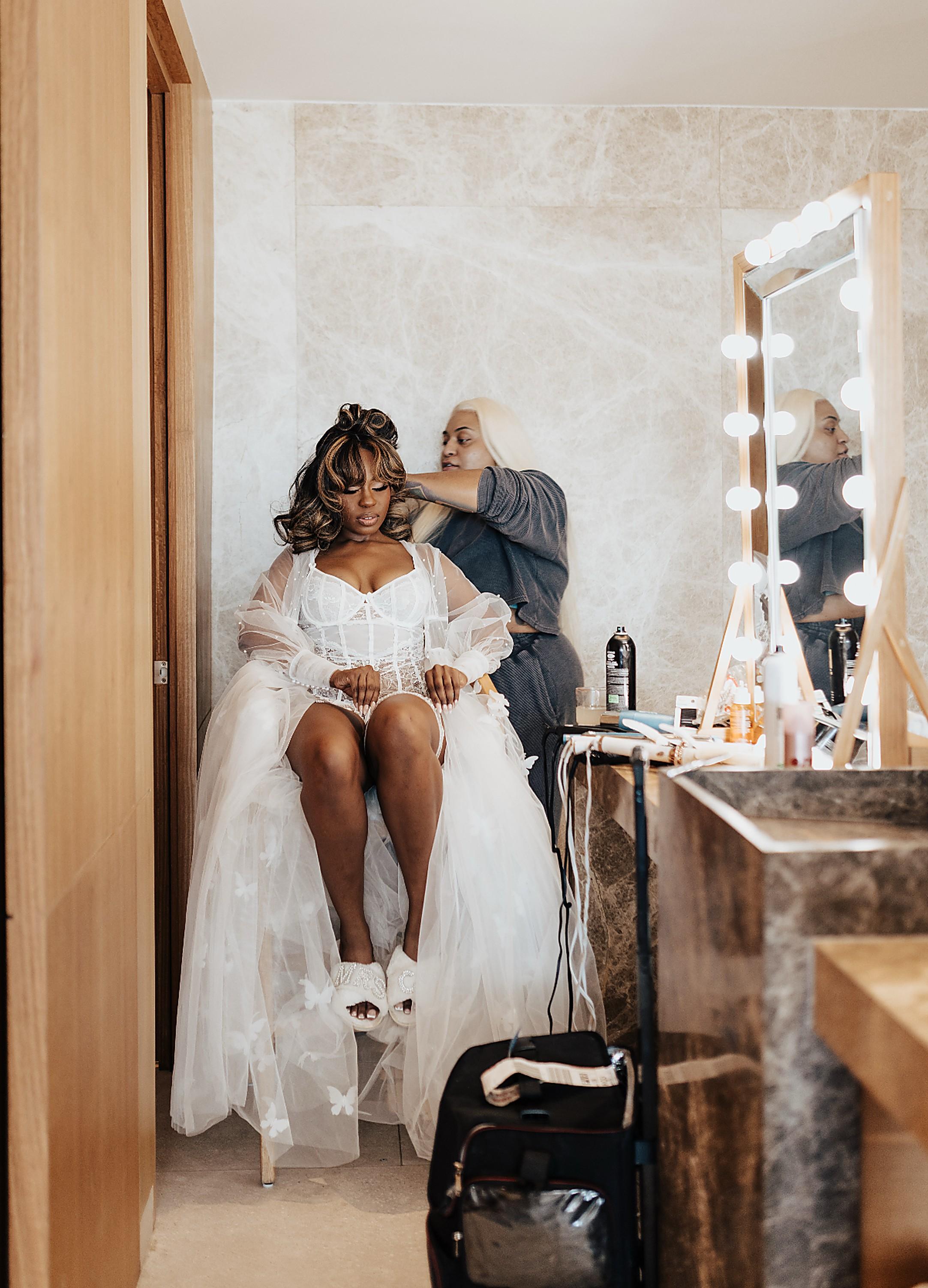 Behind the chair — bridal preparation at the lit vanity